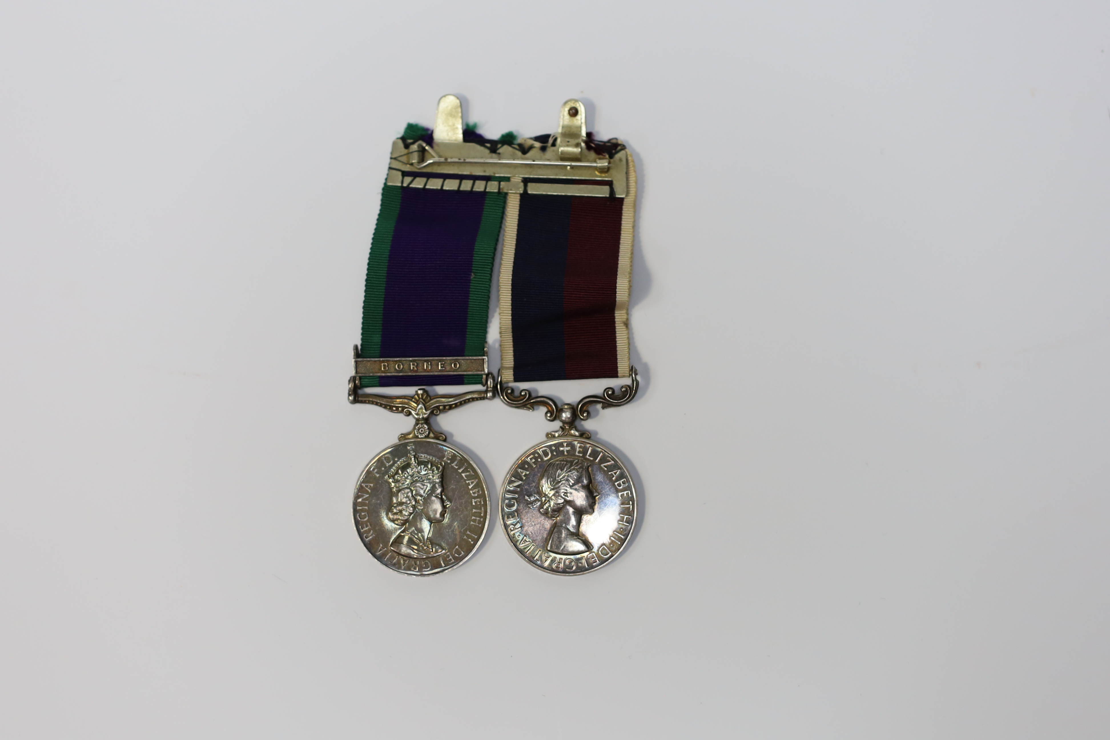 An ERII RAF medal pair awarded to Cpl. A.F.G. Pitcher RAF, comprising; a General Service Medal with a bar for Borneo and an RAF Long Service Medal, mounted on a common pin. Condition - fair to good